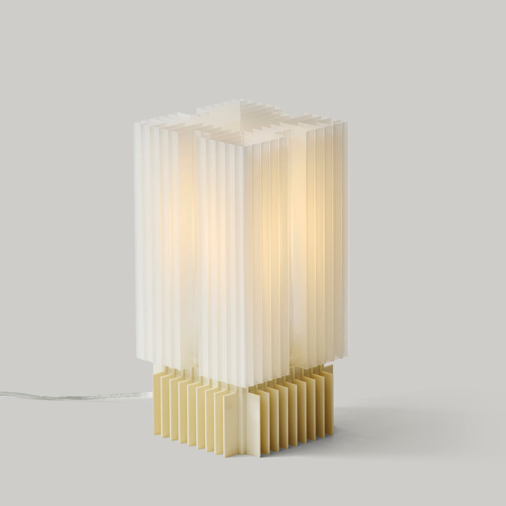 Modern table lamp with a geometric design on a light gray background