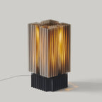 Modern table lamp with a ribbed design on a gray background