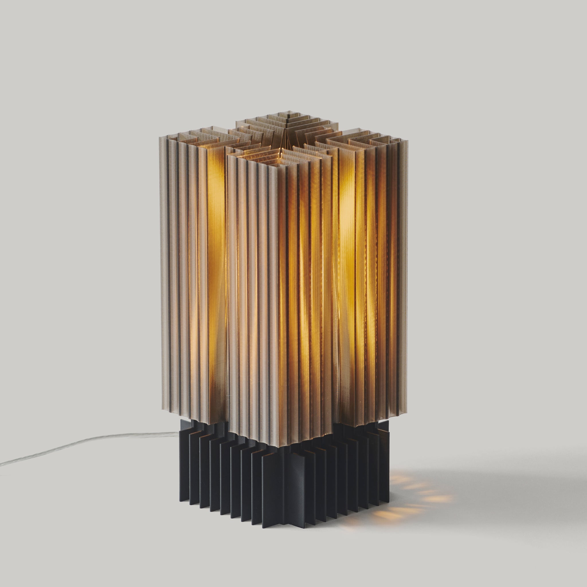 Modern table lamp with a ribbed design on a gray background