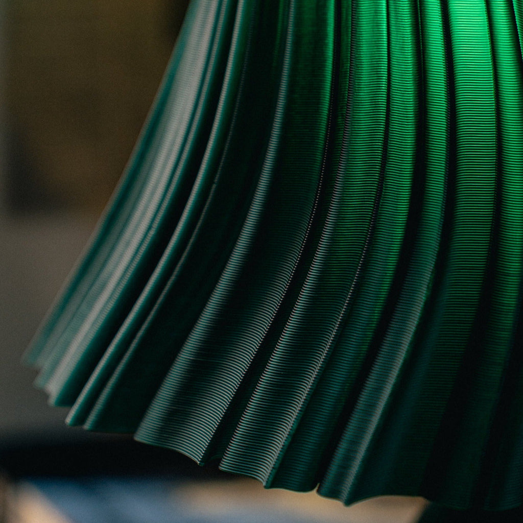Close-up of a green pleated fabric texture