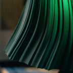 Close-up of a green pleated fabric texture