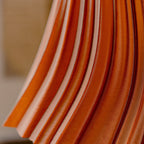 Close-up of orange fabric with a blurred background