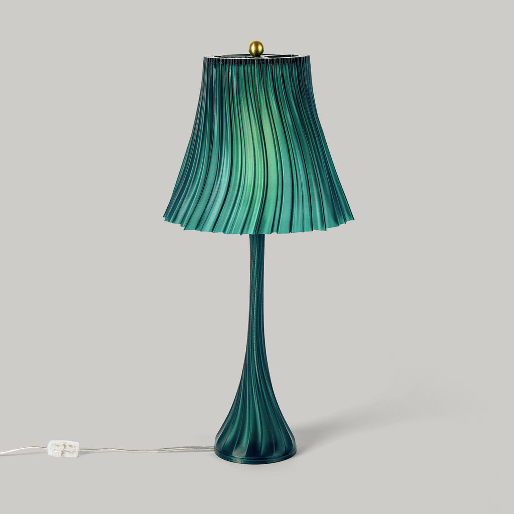 Green pleated lamp with a plain background