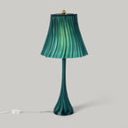 Green pleated lamp with a plain background