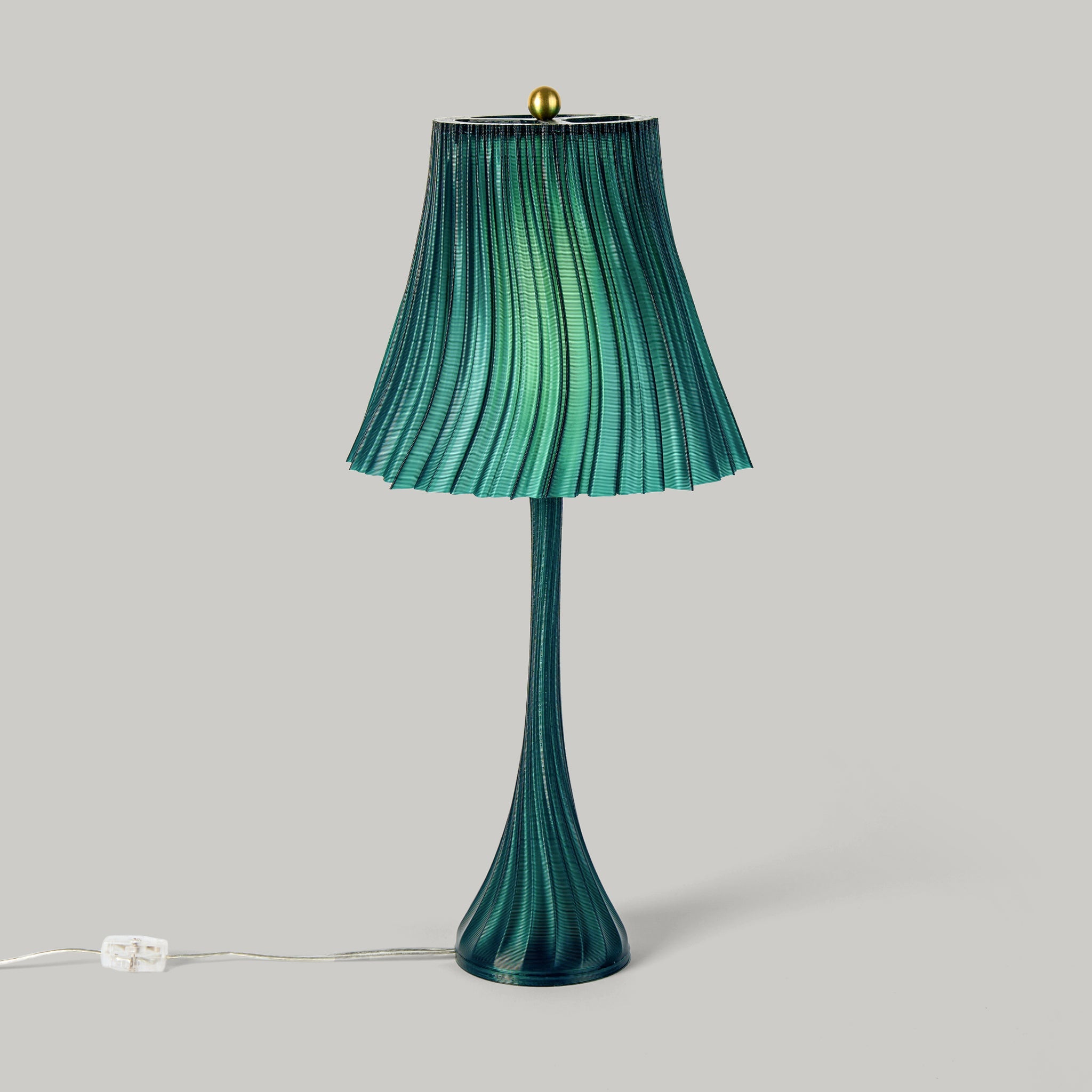 Green pleated lamp with a plain background